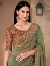 Sage green georgette saree with bronze-gold embroidered blouse and pallu