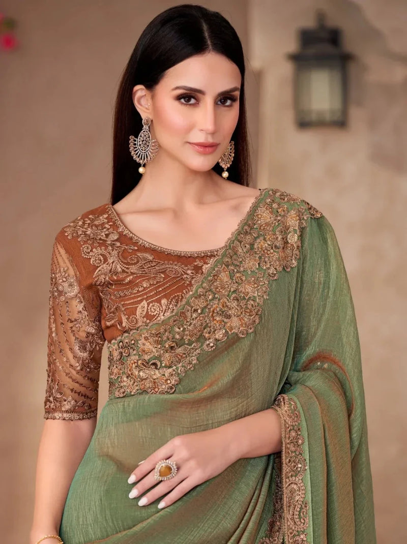 Sage green georgette saree with bronze-gold embroidered blouse and pallu