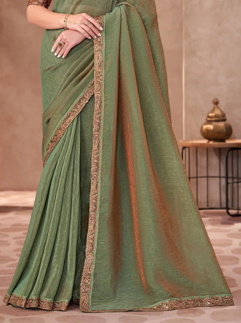 Sage green georgette saree with bronze-gold vertical embroidered border and pleats