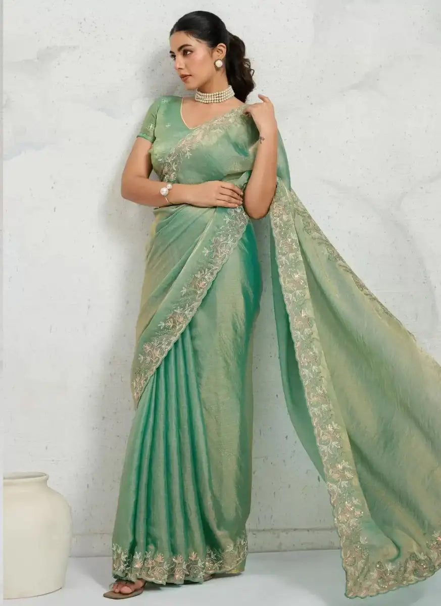 Sea green shimmer chiffon saree with metallic gold embroidered border and pleated drape