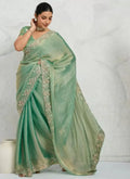 Sea green shimmer chiffon saree with metallic gold embroidered border and draped pleats