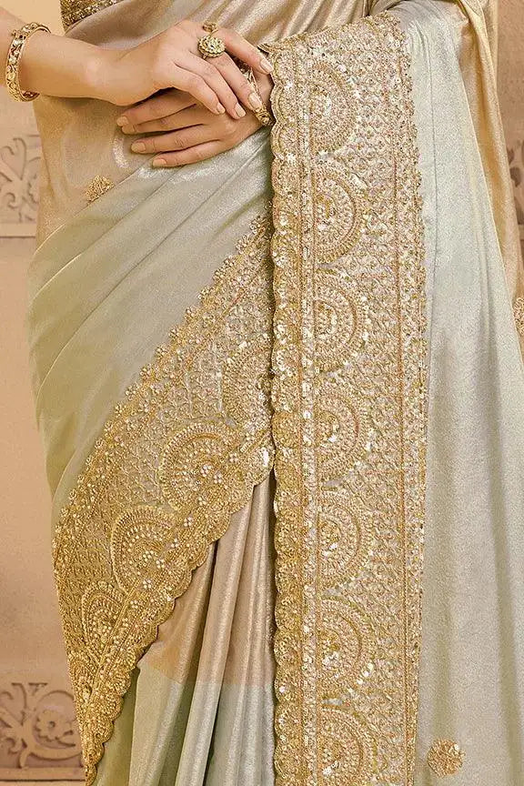 Nayoora luxe saree pallu with ornate gold zardozi border on metallic silver-gray
