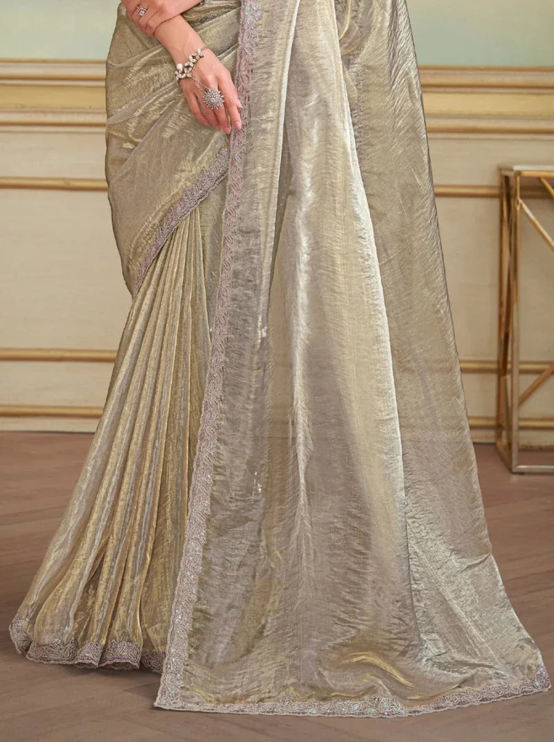 Metallic silver tissue saree drape with pleats and border detail, side view