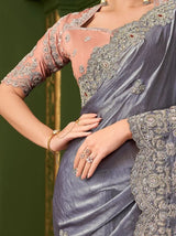 Metallic steel lavender saree with ornate gold embroidery and peach blouse sleeves