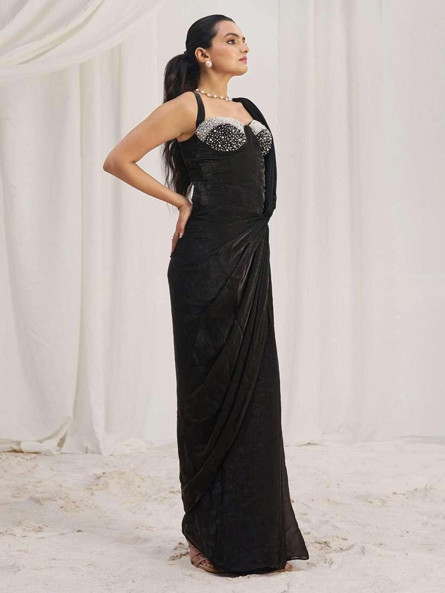 Corset-ready black saree with pearl-beaded bodice and side drape, three-quarter back