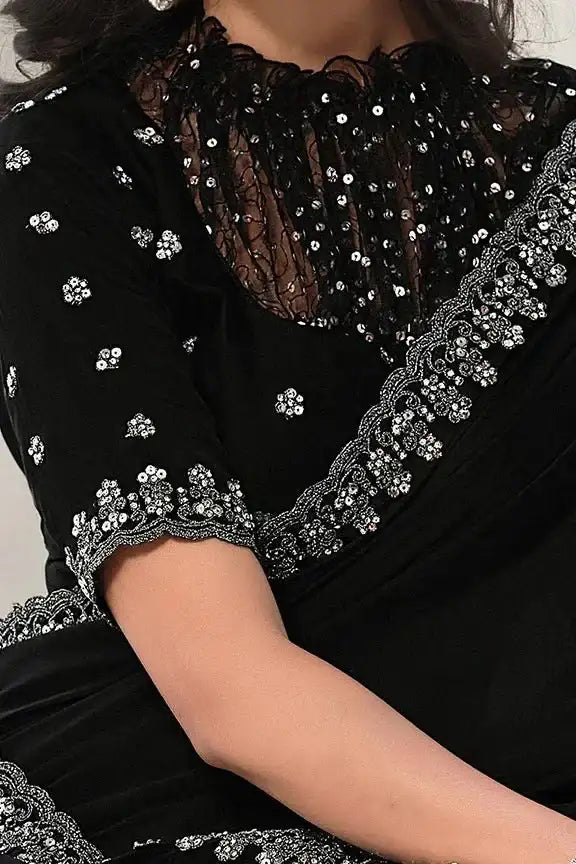 Black satin silk saree with silver sequined yoke, scalloped sleeve cuffs, mesh overlay