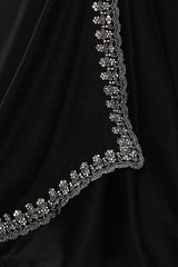 Black saree pallu edge with intricate silver sequin trim