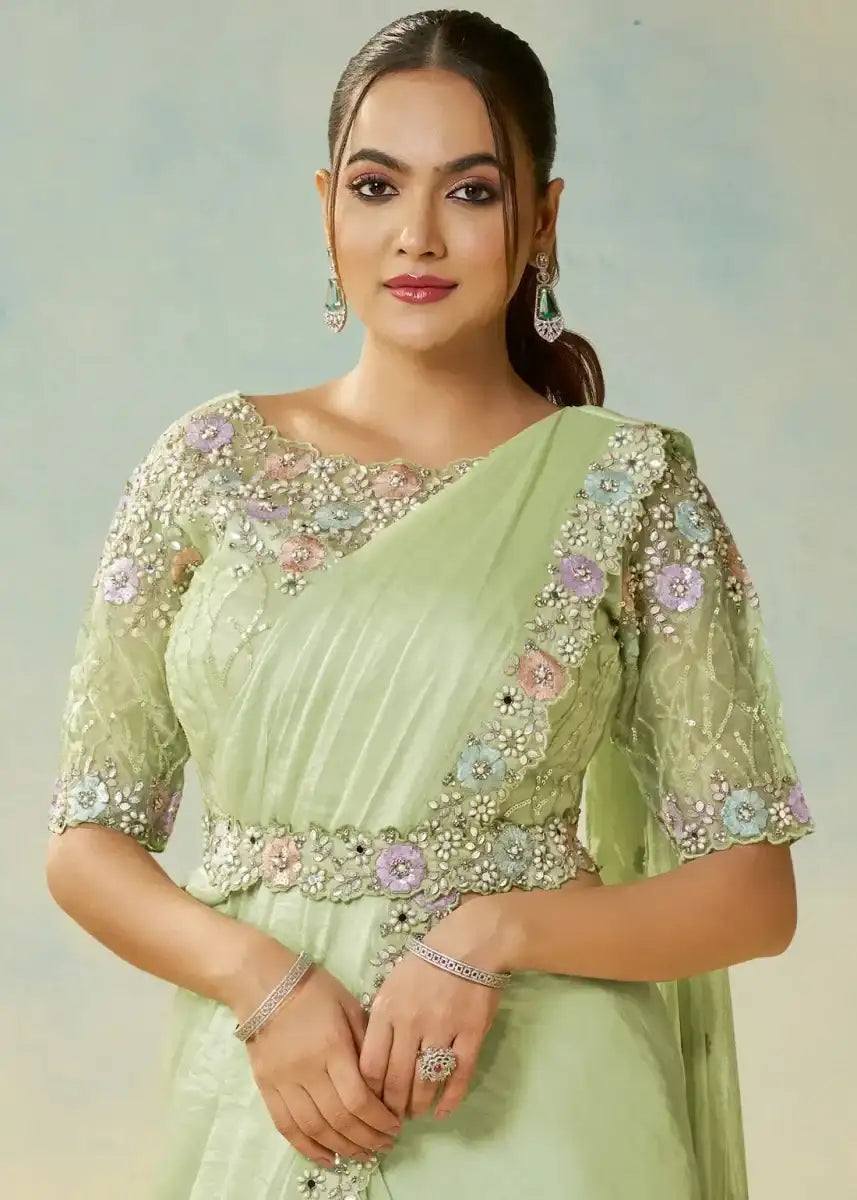 Mint green satin saree set with floral embroidered neckline and sheer embroidered sleeves