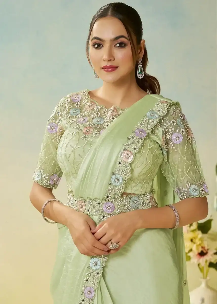 Mint green satin saree set with floral sequin blouse sleeves and draped pallu