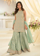 Mint green embroidered gharara suit with tiered skirt, wide hem, and dupatta