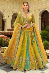 Mustard and teal mirror-work lehenga with flared skirt and sheer dupatta