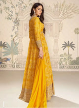 Mustard yellow bandhani silk embroidered gown, side view with long sleeves and full skirt