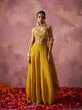 Mustard yellow sharara set with embroidered gold bralette and flowing cape drape