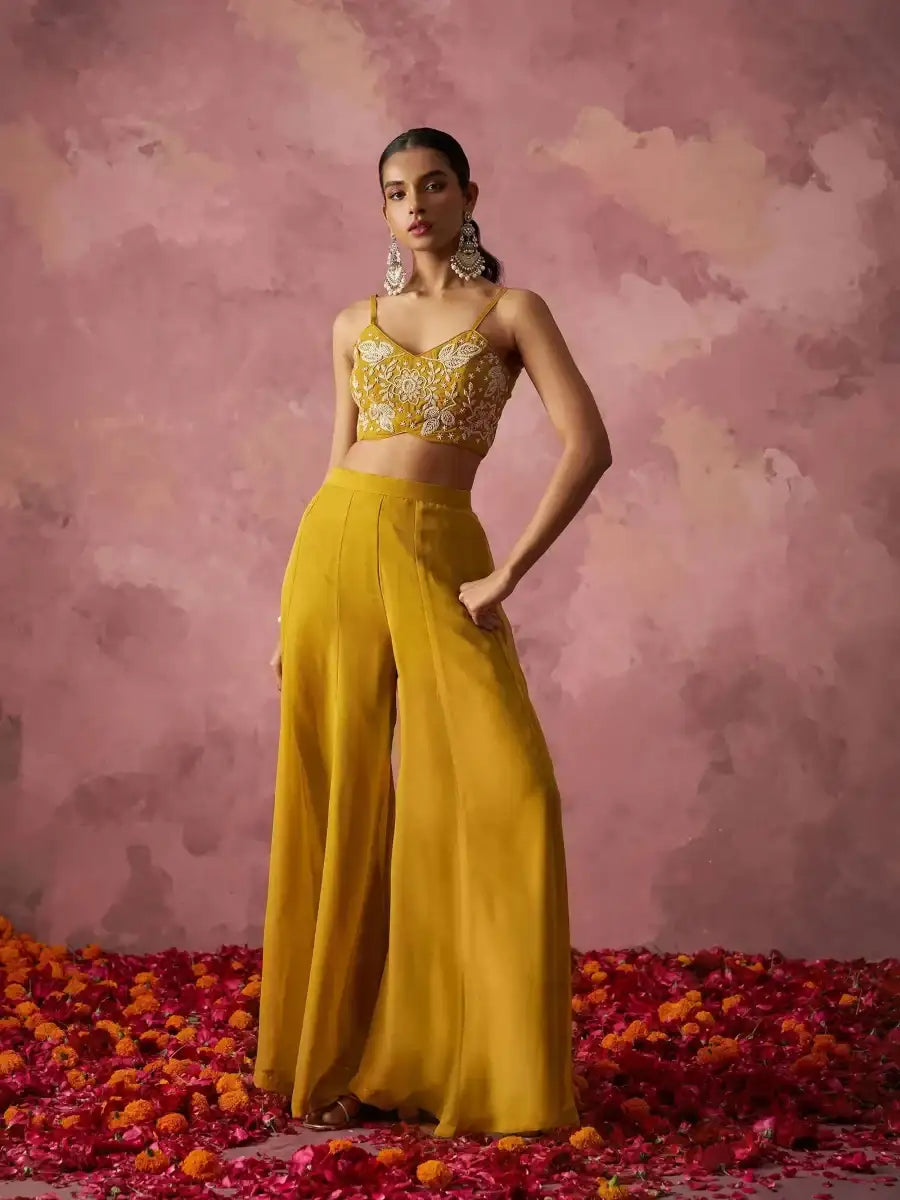 Mustard yellow sharara set with gold embroidered bralette and wide-leg sharara