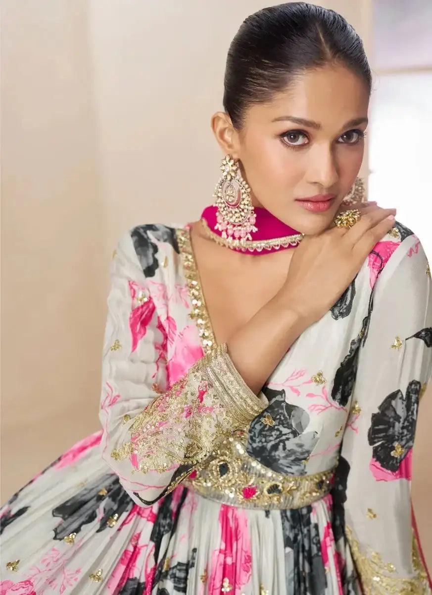 Off-white floral embroidered gown with gold trim and pink dupatta drape