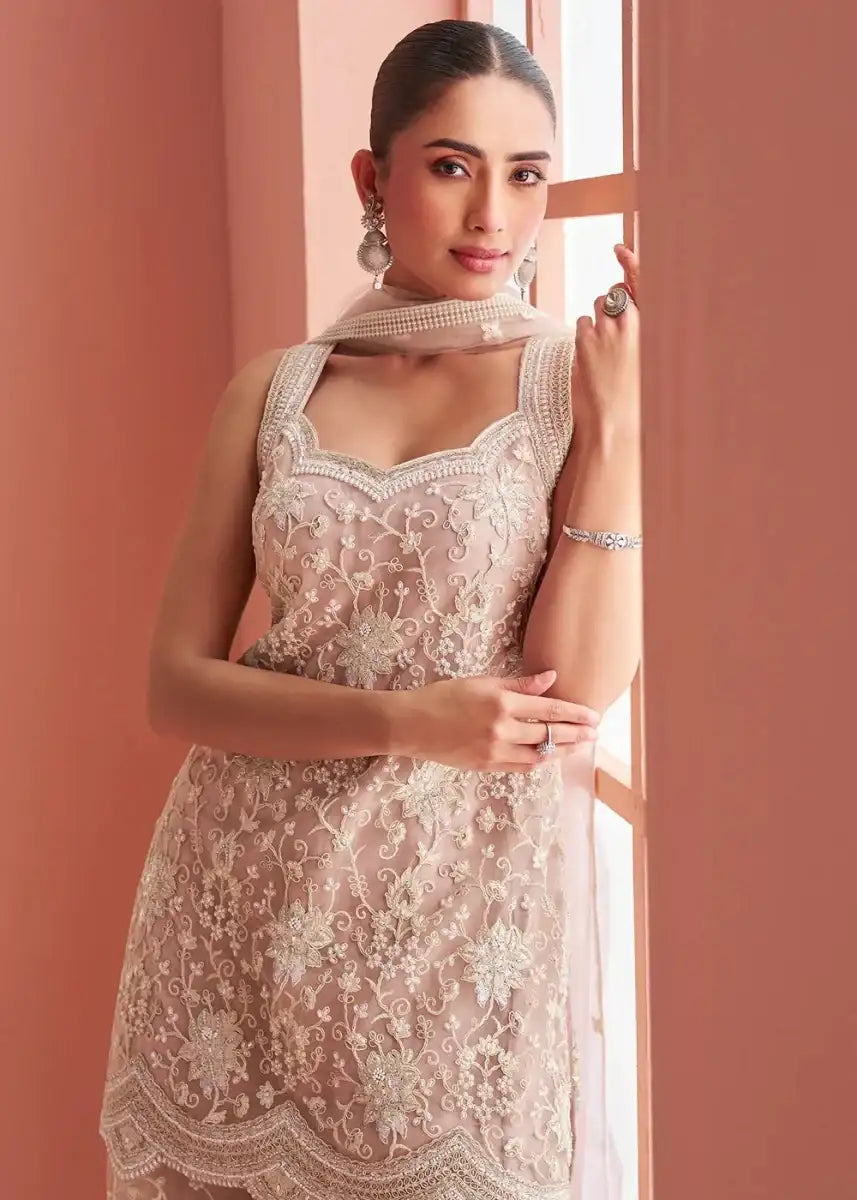 Dusty rose embroidered sleeveless kurti with floral motifs and scalloped lace hem