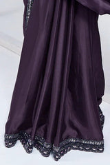 Aubergine purple sari with pleated fabric and dark scalloped sequined hem