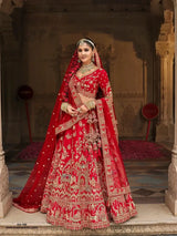 Crimson red bridal lehenga with gold-toned embroidered skirt and matching dupatta
