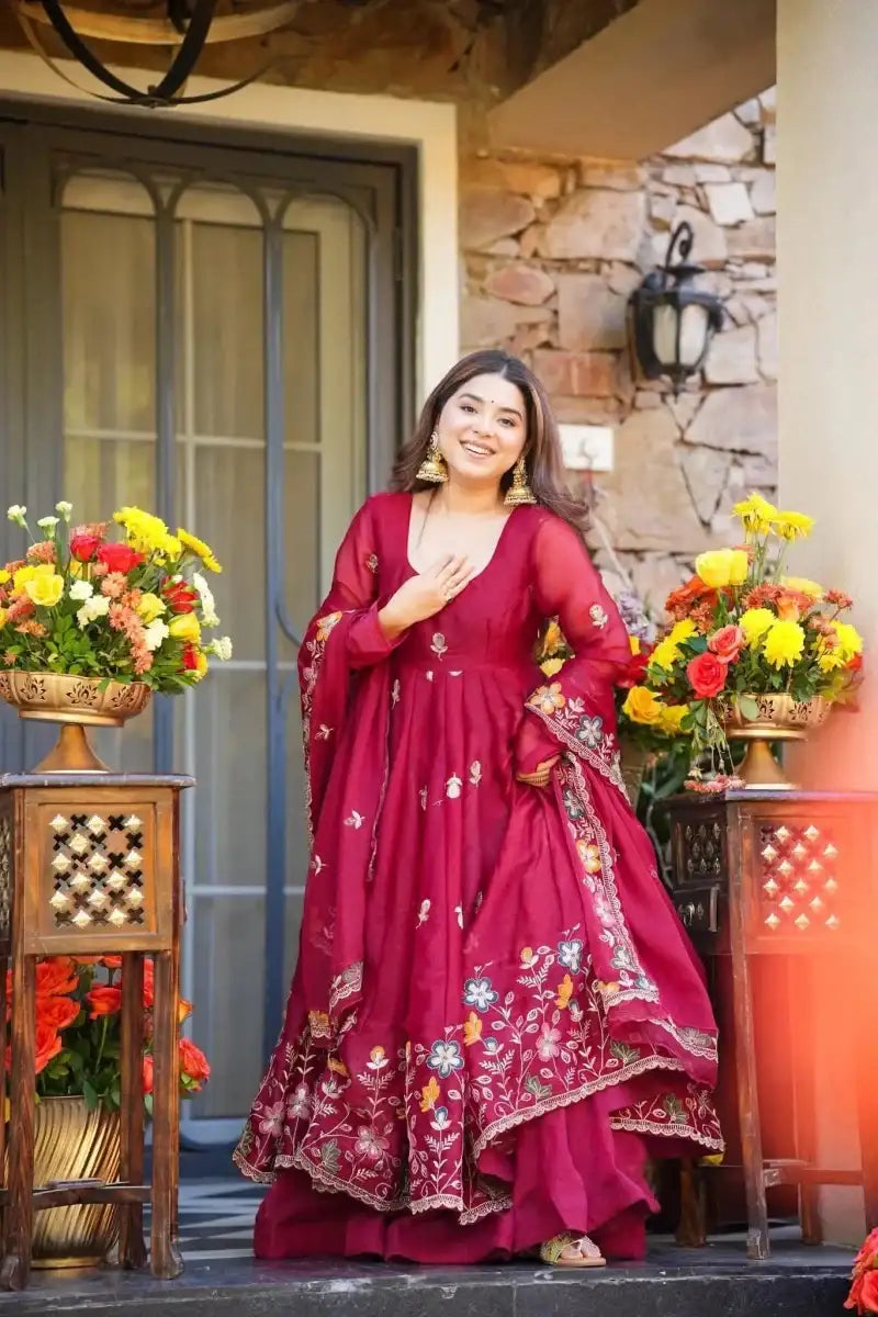 Maroon anarkali dress with floral sequin embroidery and gold-toned border, full skirt