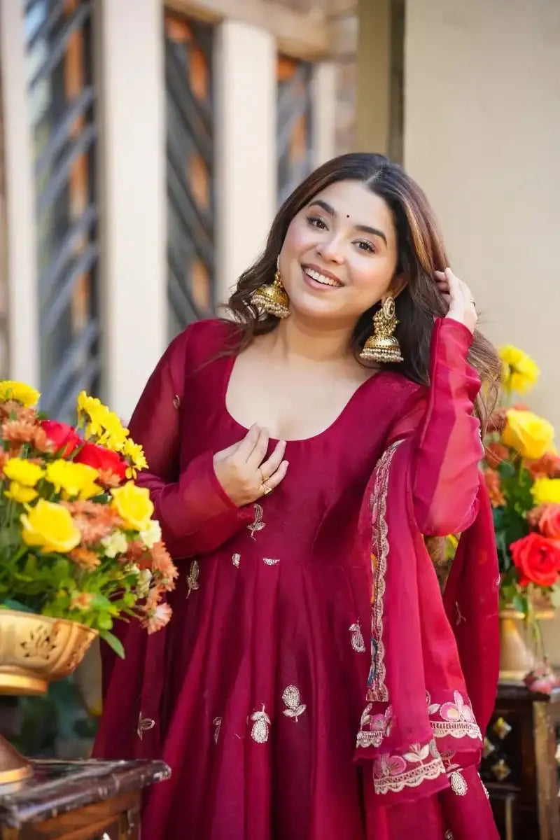 Maroon anarkali dress with floral sequin motifs and embroidered neckline, three-quarter sleeves