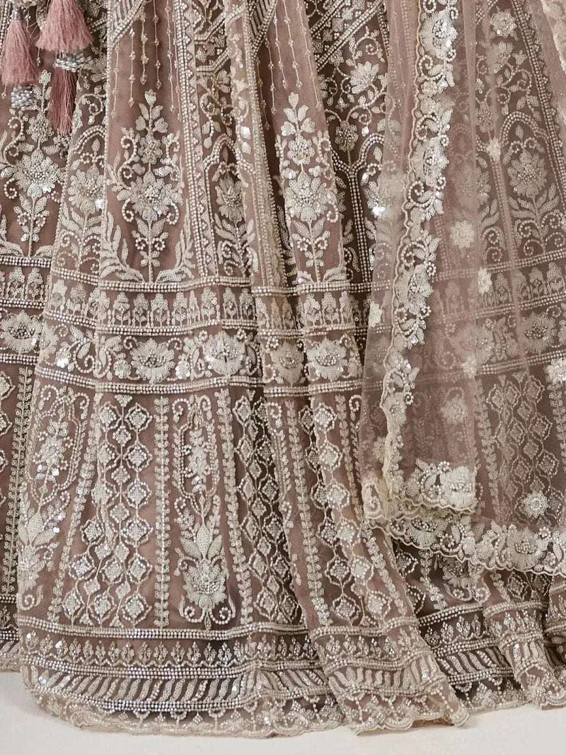 Close view of embroidered lehenga skirt panels with floral motifs and ornate banding