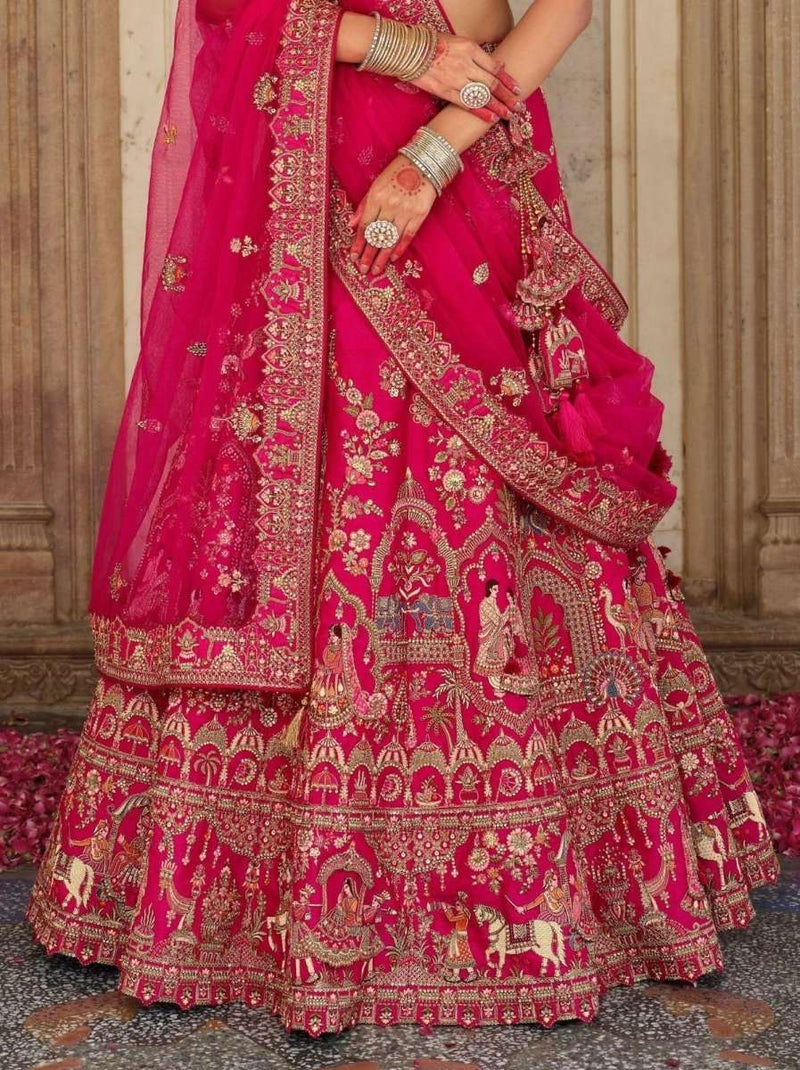 Bridal silk lehenga skirt in rani pink with gold zari and embroidered border