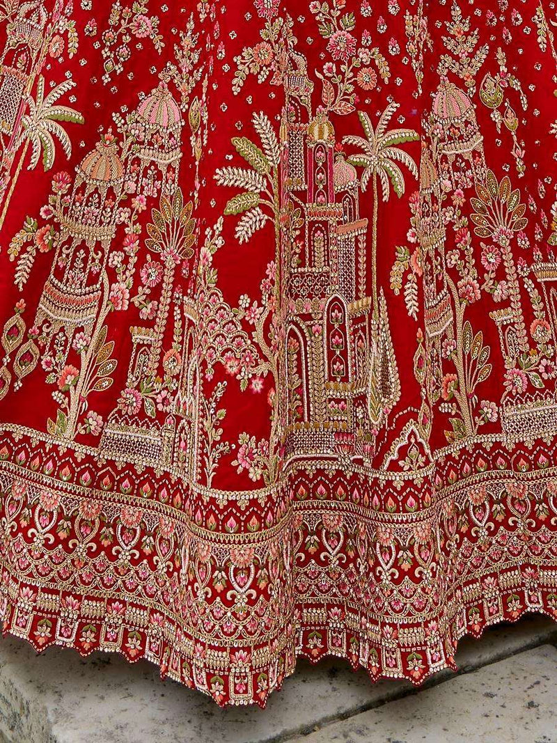 Red bridal lehenga with gold embroidered doli work and ornate border detailing