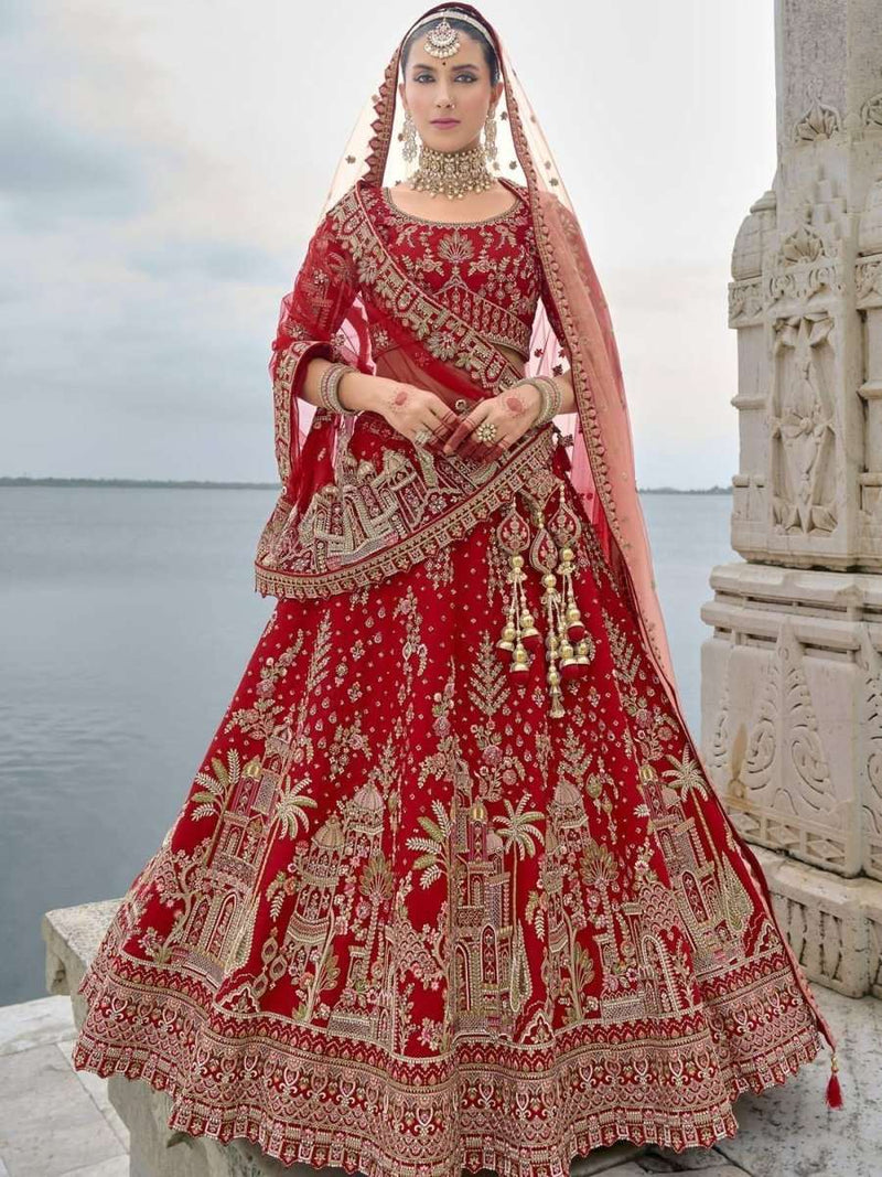 Red bridal lehenga with gold embroidered full skirt and draped dupatta veil