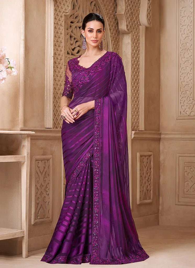 Royal violet satin silk saree with textured borders and sheer back blouse, full drape
