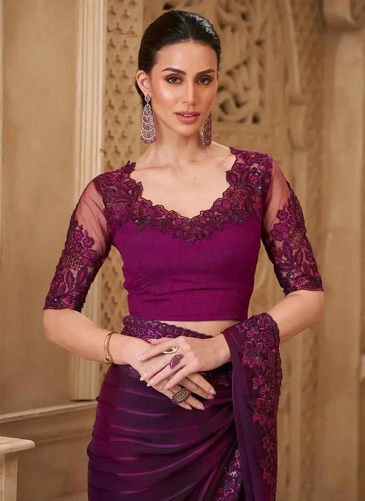 Royal violet satin saree with embroidered neckline and quarter-length lace sleeves