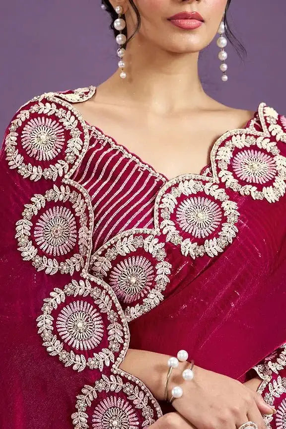 Ruby pink velvet saree with off-shoulder striped blouse and circular embroidery