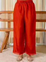 Rust red matching pants with elastic waist and lace hem detail