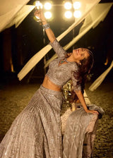 Silver metallic lehenga with mirror-work sleeves, pleated flared skirt and draped dupatta
