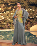 Slate grey organza cape over mustard embroidered dress with gold-toned trim