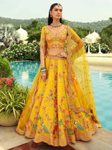 Yellow floral lehenga with mirror-work border and draped dupatta