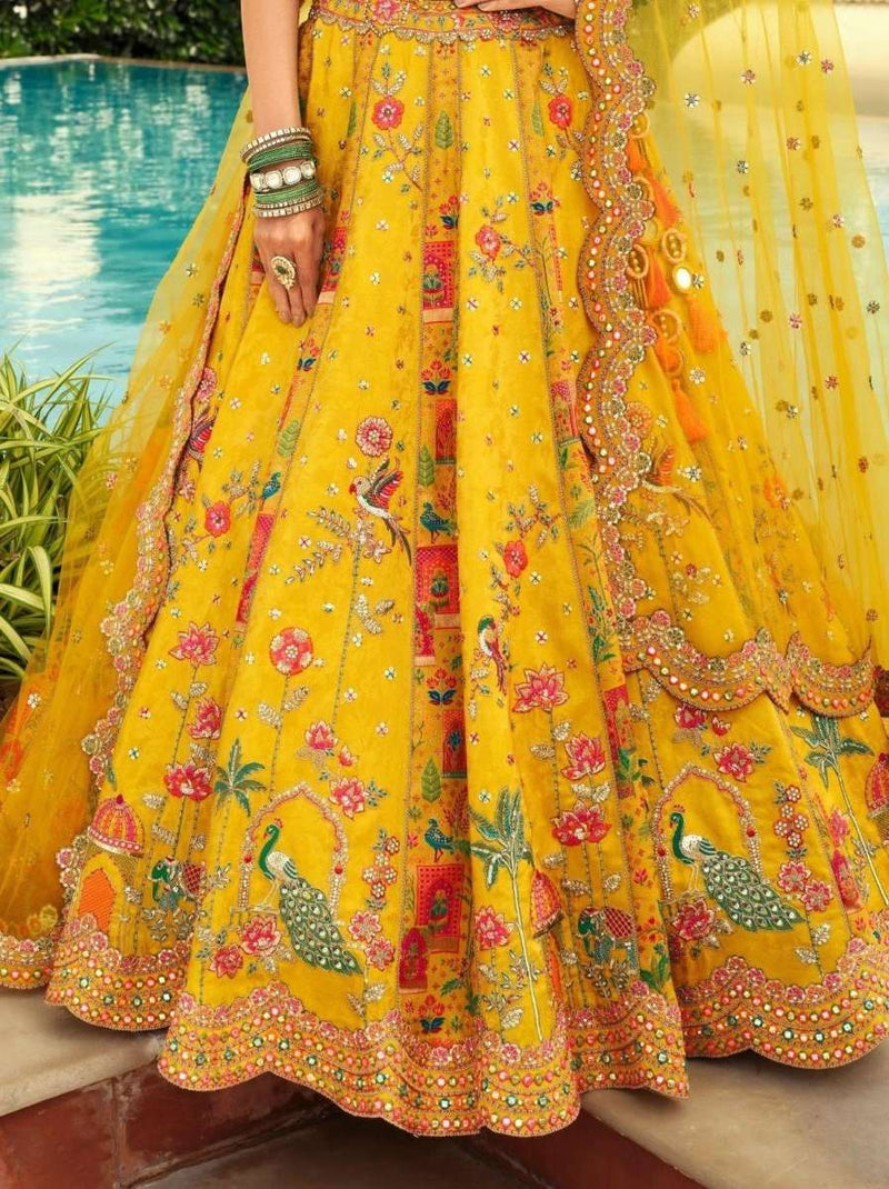 Yellow floral lehenga skirt with ornate mirror-work hem and full flare