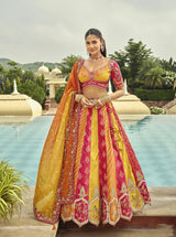 Silk lehenga set with bright yellow and rani pink panels, embroidered borders, dupatta