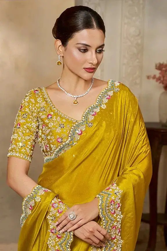 Yellow saree with floral sequin embroidery on bodice and pallu
