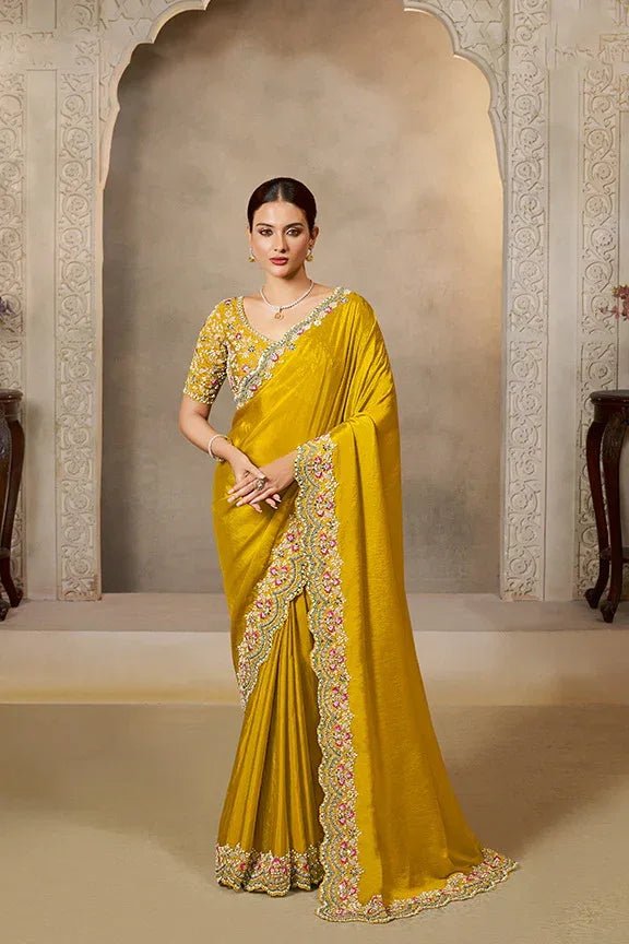 Yellow saree with scalloped floral embroidered border