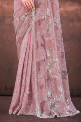 Light pink net saree fabric, sequined floral embroidery and sparkling drape