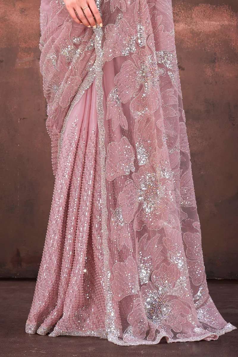 Light pink net saree fabric with glittering floral sequin appliques