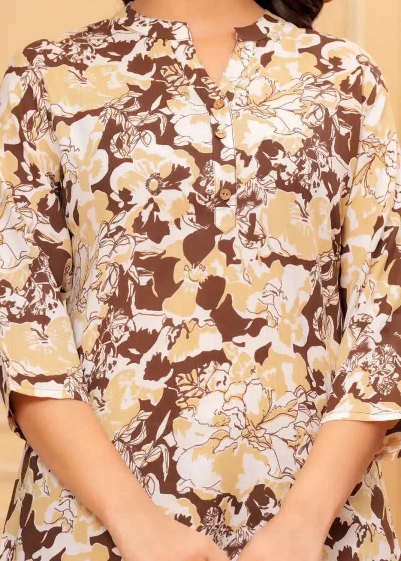 Floral tunic close-up: buttoned V-neck and full print in coffee brown, cream