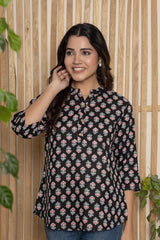 Black floral tunic with V-neck button placket and three-quarter sleeves