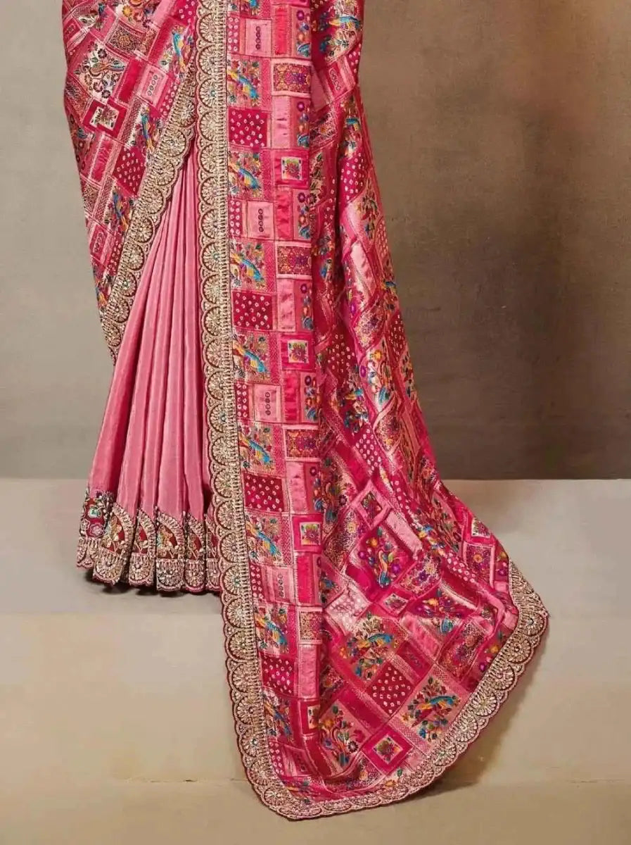 Magenta silk saree drape with wide patterned border and multicolor trim