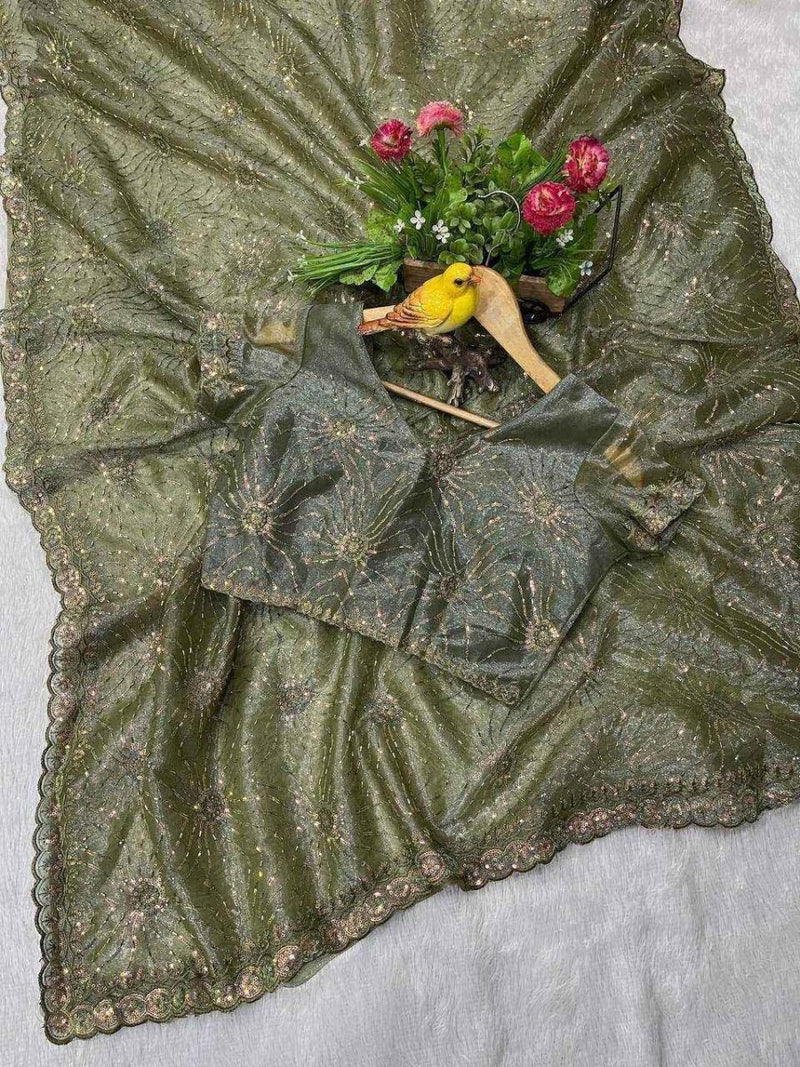Green net saree border close-up with gold sequin bead work and scalloped edge