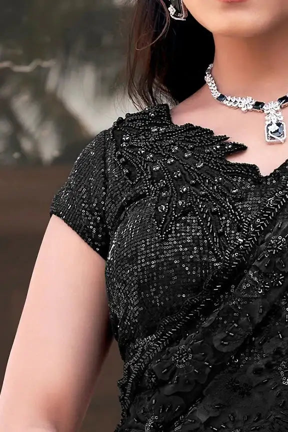 Black tulle saree with dense beadwork and scalloped floral applique neckline