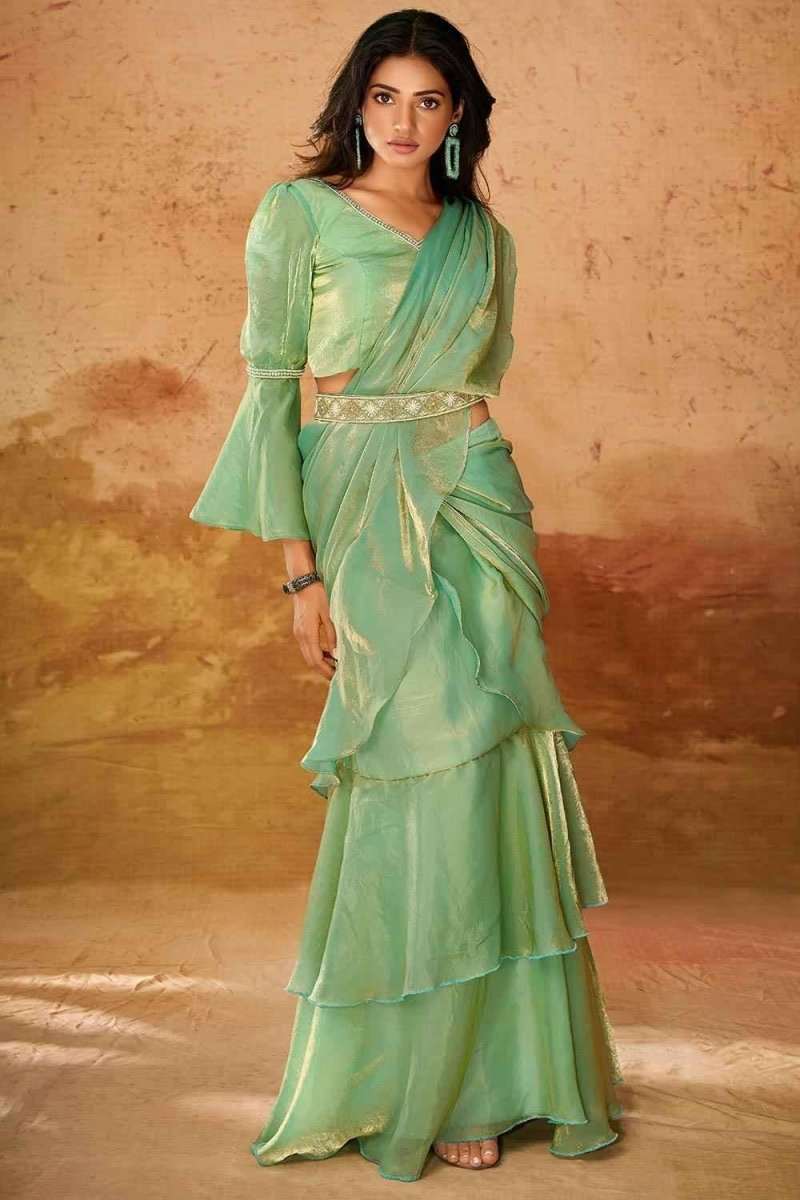 Mint green organza western saree with tiered ruffle skirt and draped sash