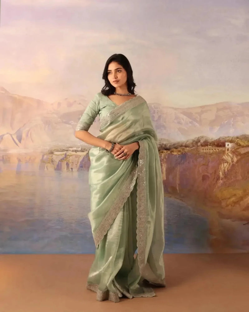 Mint green silk saree with gold sequin lace border and matching blouse