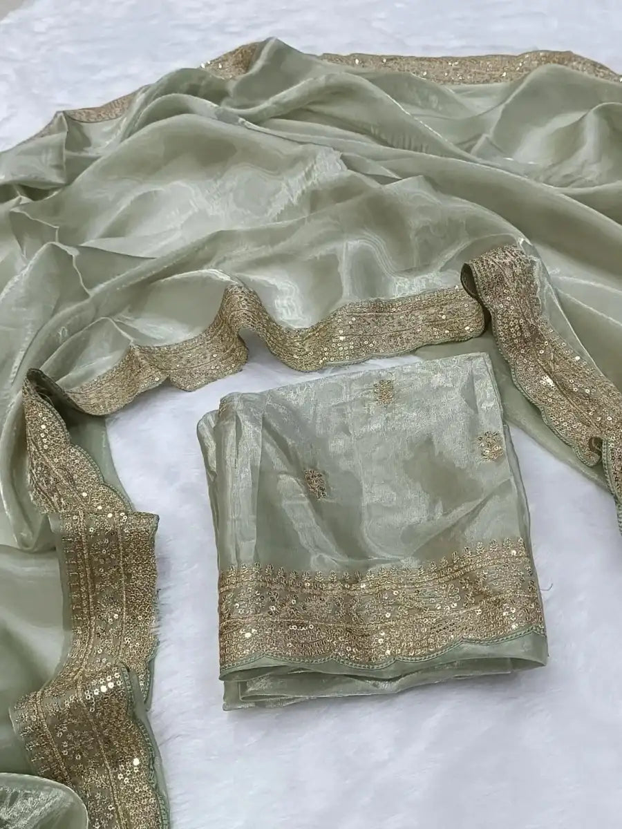Mint green silk saree set with gold sequin lace border and matching blouse piece