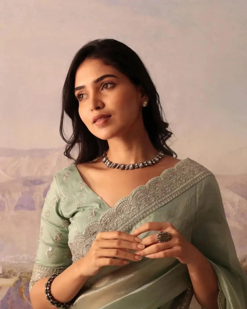 Mint green silk saree with gold sequin lace yoke and beaded necklace